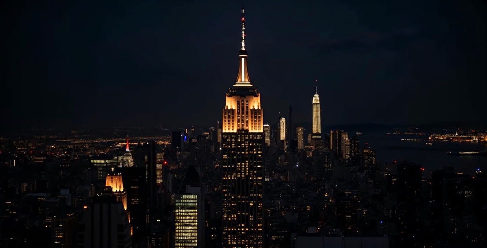 The New York City skyline at night with the Empire State Building